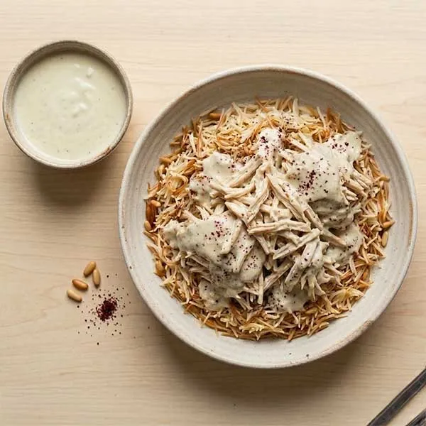 Jordanian mansaf-style chicken with yogurt sauce & vermicelli rice